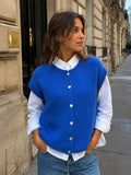Ärmelloser Cardigan Blue von MAËLYS PARIS aus Kid Mohair mit Rundhalsausschnitt, Knopfleiste und lockerer Passform.