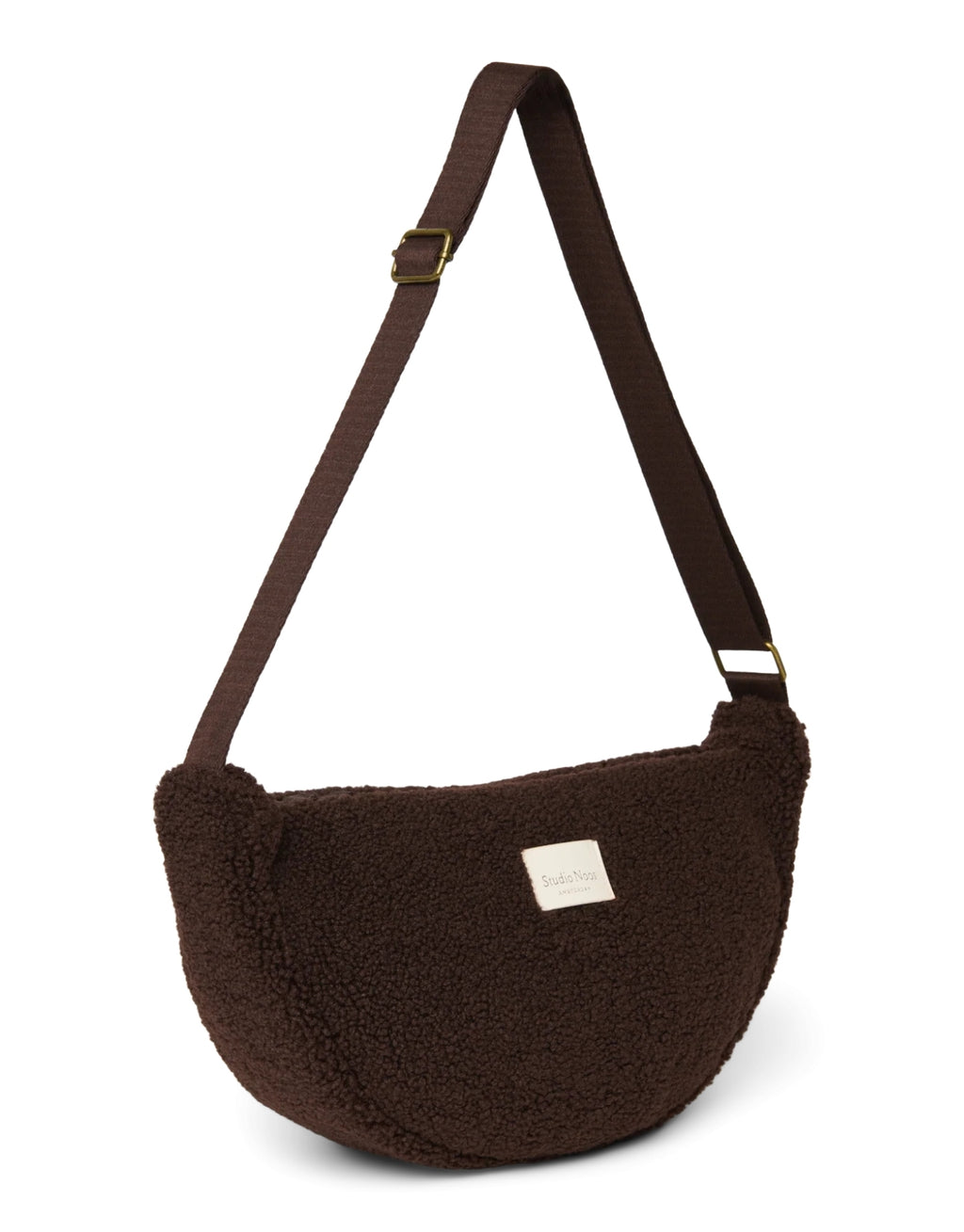 Schokoladenbraunes Fanny Pack Chocolate Teddy von Studio Noos aus weichem Teddy-Material mit Reißverschluss und verstellbarem Riemen.