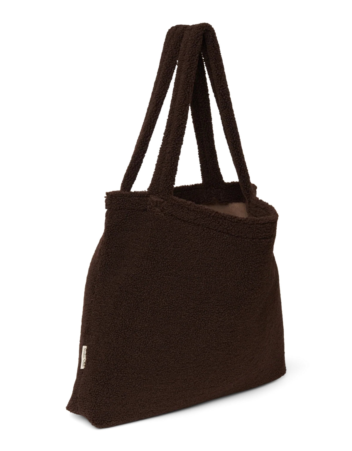 Schokoladenbraune Mom Bag Chocolate Teddy von Studio Noos aus weichem Teddy-Material mit langen Tragehenkeln.