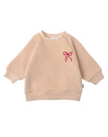 Liliput Sweatshirt Mini Schleife beige mit rotem XMAS-Schleifenprint, Kids-Sweater für Mini & Me Looks.