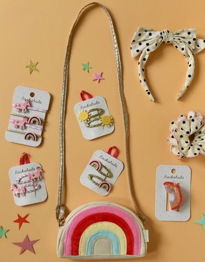 Pink Pony Stripy Haargummis von Rockahula im 4er-Set mit glitzernden Ponys, Regenbogen-Motiven und elastischen Haargummis in Gold und Rosa.