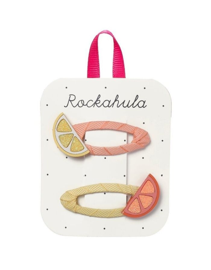 Citrus Slicer Glitter Haarspangen von Rockahula mit glitzernden Zitronen- und Orangenscheiben auf bunten, stoffbezogenen Klickspangen.