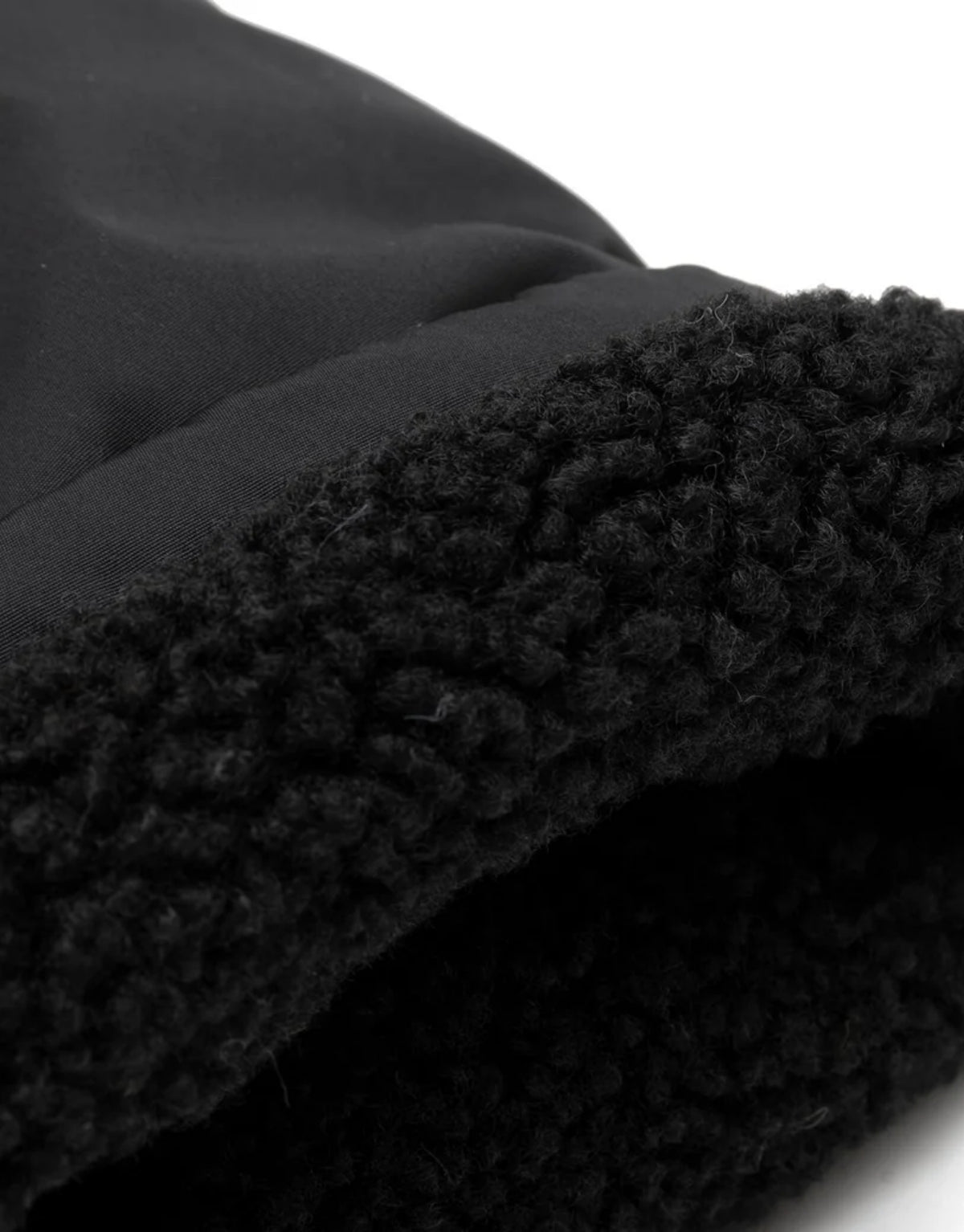 Warme Kinderwagen-Handschuhe von Jollein mit weichem Bouclé-Futter und Klettverschluss zur Befestigung am Kinderwagen.