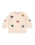 Beiges Lou Sweatshirt aus Bio-Baumwolle von Konges Sløjd mit bunten Herzapplikationen.
