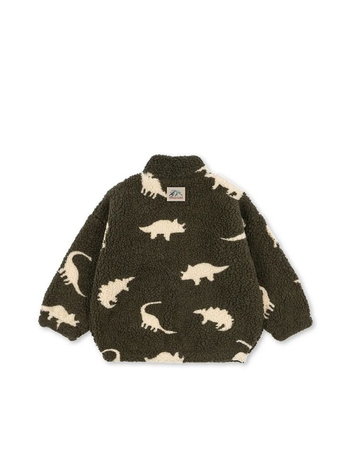 Teddyjacke Jody Dino Silhouette mit weißen Dinosauriern von Konges Sløjd als Freisteller von hinten