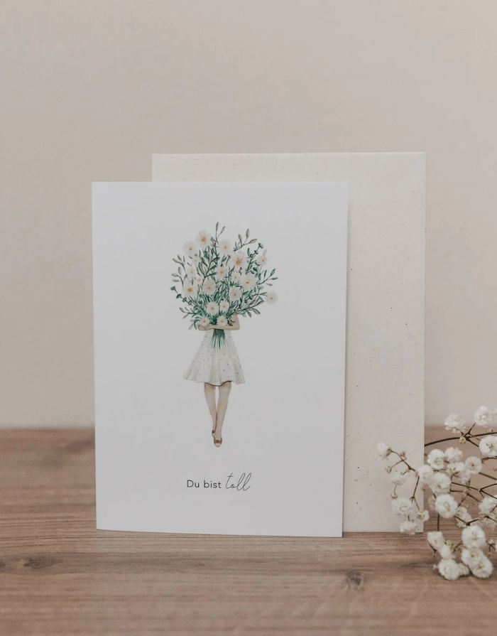 Klappkarte mit Umschlag von Eulenschnitt mit dem Bild einer Frau, die einen großen Blumenstrauß hält und der Aufschrift: Du bist toll