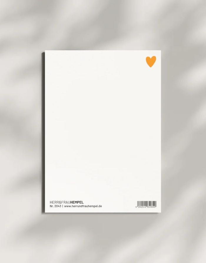 Postkarte von Herr und Frau Hempel aus hochwertiger Holzschliffpappe im DIN-A6-Format mit Blanko Rückseite mit einem kleinem Herz in Orange in der Ecke oben rechts